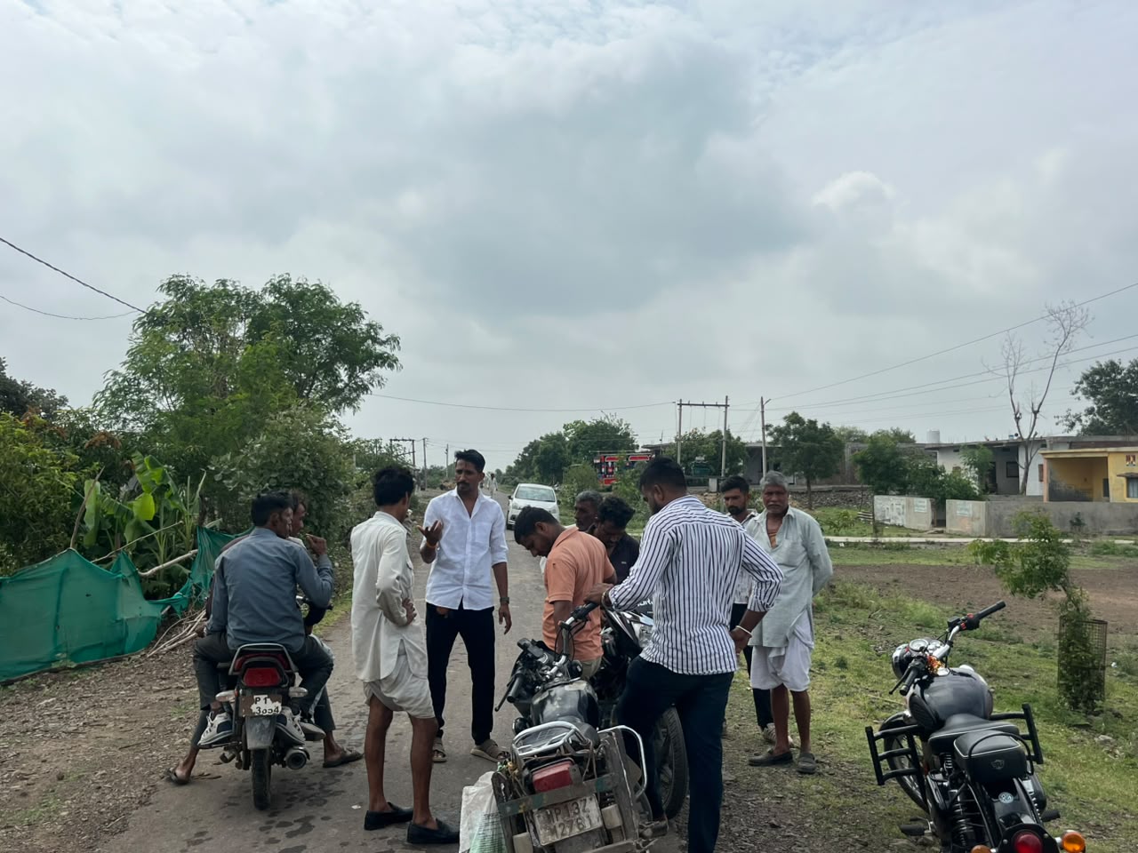 Farmer Union leader Dev Singh Gurjar meeting villagers in Nagda over Grasim CSR fund allegations.