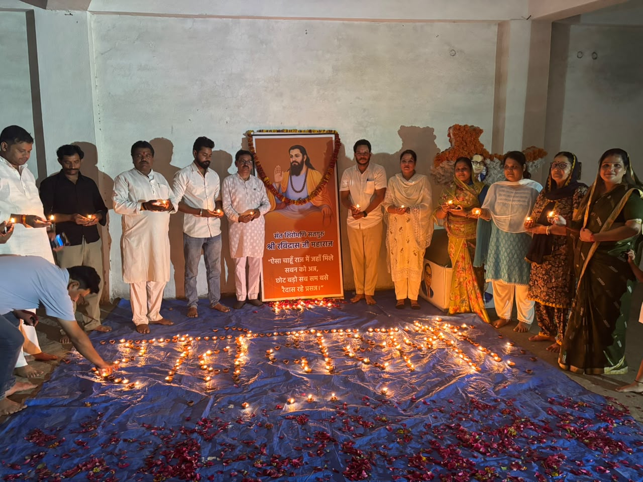 BJP leaders and workers light ceremonial lamps at Sant Ravidas Temple in Ashoknagar during the Samrasta Sankalp Abhiyan, celebrating the 650th birth anniversary of Guru Ravidas with a grand Deepotsav