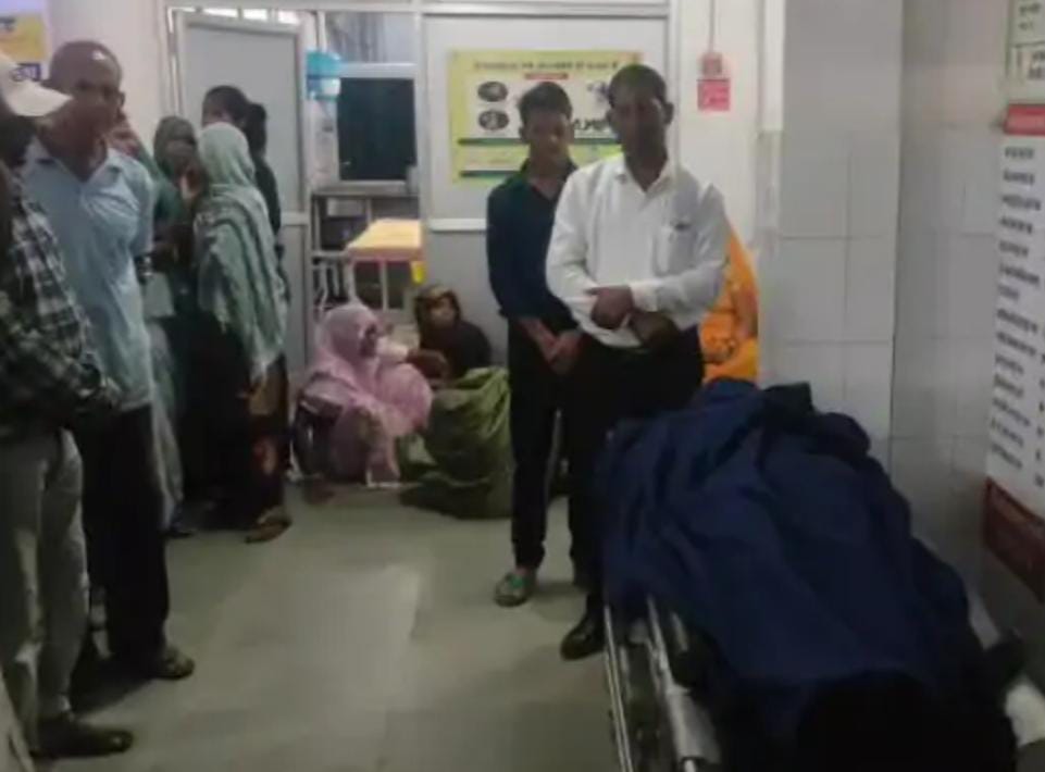 Police and local residents gather near a biogas tank at a house in Semarwar village, Anuppur district, after a 40-year-old man died in an accidental fall while cleaning the tank