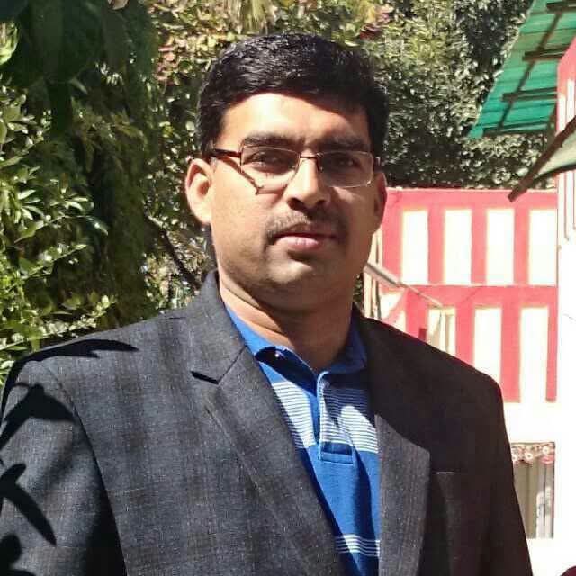 Outgoing Anuppur Collector Harshal Pancholi and newly appointed Collector Ratnakar Jha, following the Madhya Pradesh government's late-night administrative reshuffle transferring Pancholi to Bhopal and appointing Jha to lead Anuppur distric