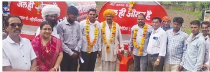 Union Minister of State Savitri Thakur distributing water tankers to Gram Panchayats during a public programme in Jirabad Mandal, Manawar, Dhar district, Madhya Pradesh, in the presence of BJP leaders, local representatives, and villagers
